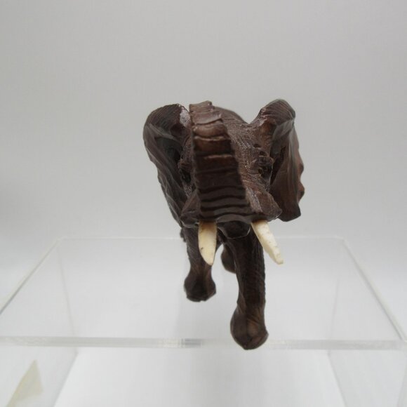 Vintage raised trunk resin elephant with tusks - brown textured faux wood - 3" - Picture 6 of 11